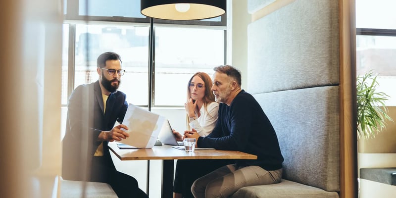 Tech startup founders discussing legal mistakes with a solicitor